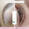 Close-up of a woman's eye with long lashes and a white lash/brow lifting bottle centered on a pink divider, promoting cysteamine lash & brow lifting (vegan).